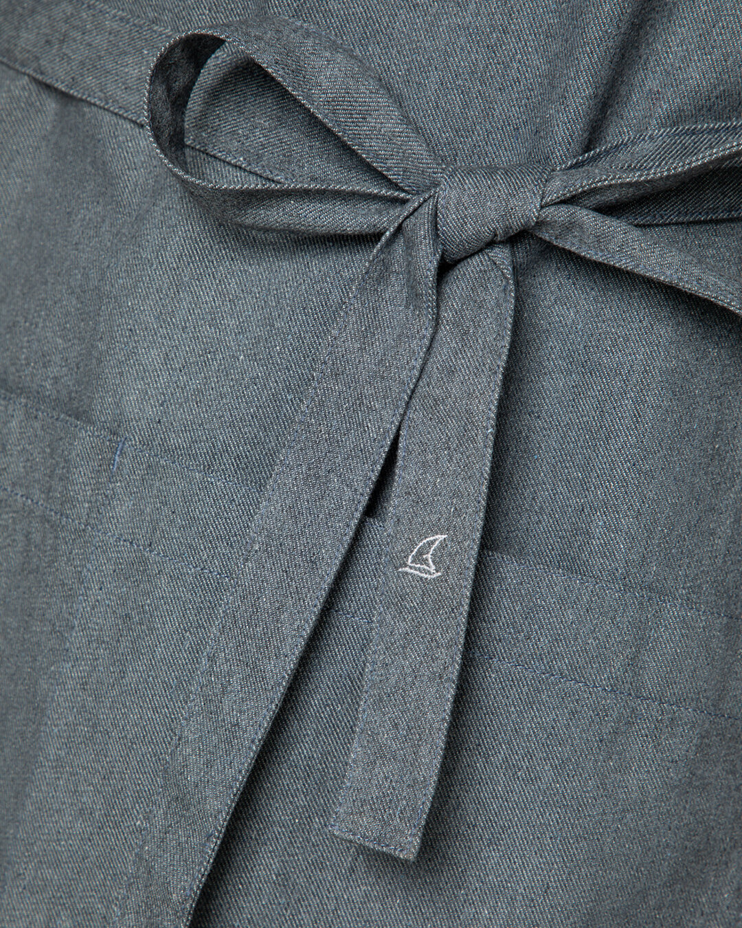 Bib apron from the Circular Collection as an example of textile recycling.